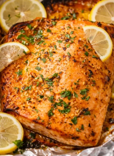 Garlic Butter Baked Salmon served with asparagus, ready in 20 minutes.