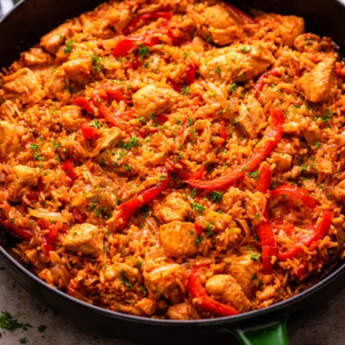 One pan chicken and rice dinner ready in 30 minutes with colorful vegetables.
