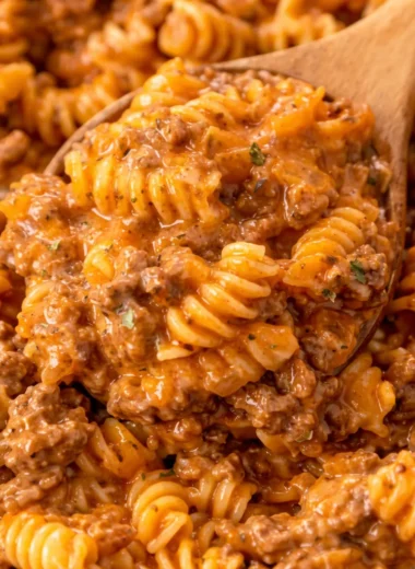Easy 30 Minute One Pan Pasta With Ground Beef topped with cheese in a skillet.
