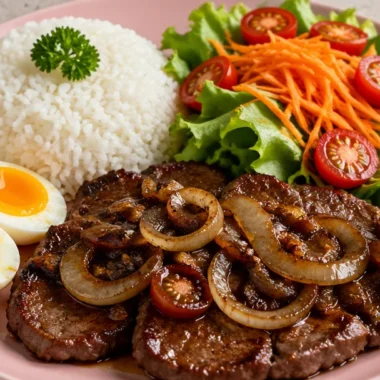 Savory garlic butter steak plate with rice and fresh salad