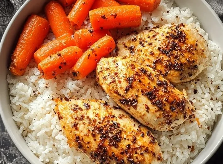 Delicious black pepper chicken breast served with rice and glazed carrots