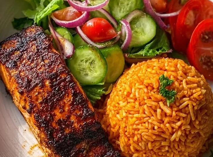 Delicious blackened salmon with seasoned rice and fresh garden salad