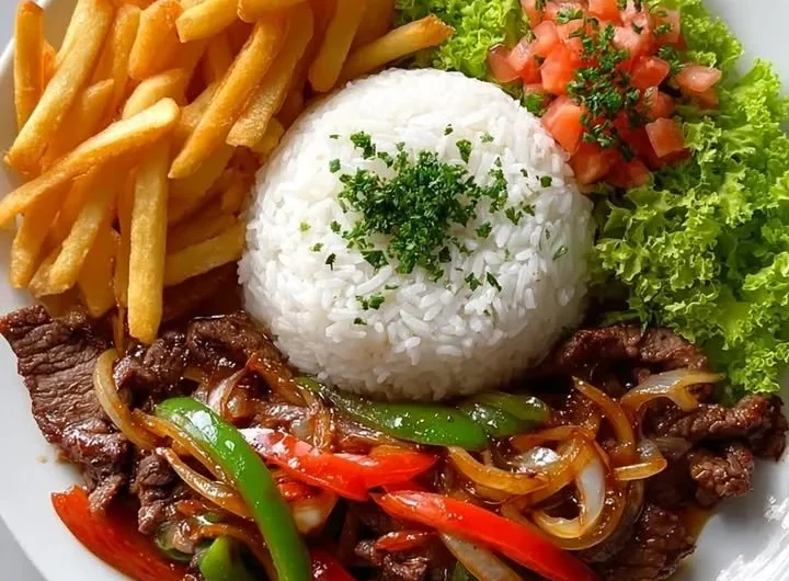Crispy beef stir-fry plate with rice, fries, and salad ready to enjoy
