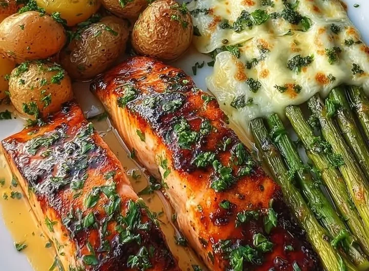 Crispy garlic butter salmon served with asparagus and roasted potatoes