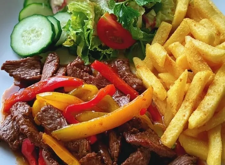Pepper steak strips served with crispy fries and fresh garden salad