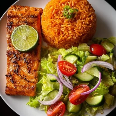 Zesty lime salmon served with Spanish rice and garden salad