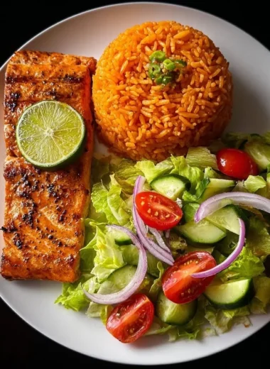 Zesty lime salmon served with Spanish rice and garden salad