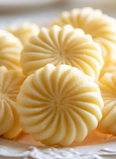 Tray of buttery spritz cookies, a traditional German treat, ready to enjoy.
