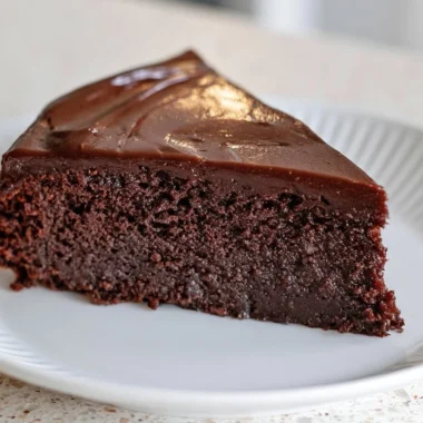 Slice of creamy French chocolate cake with rich chocolate frosting