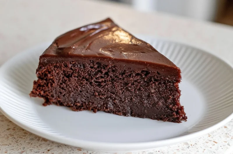 Slice of creamy French chocolate cake with rich chocolate frosting