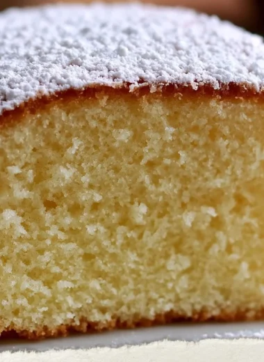 Slice of Golden Savoy Sponge Cake with delicate layers and a golden crust
