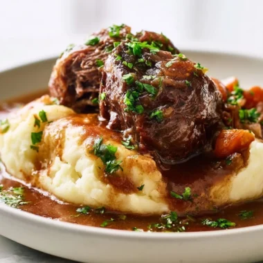 Savory hasenpfeffer rabbit stew served in a rustic bowl with herbs